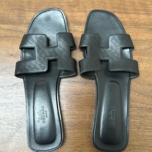 Hermes Oran Sandal in Black Leather with Perforated H’s